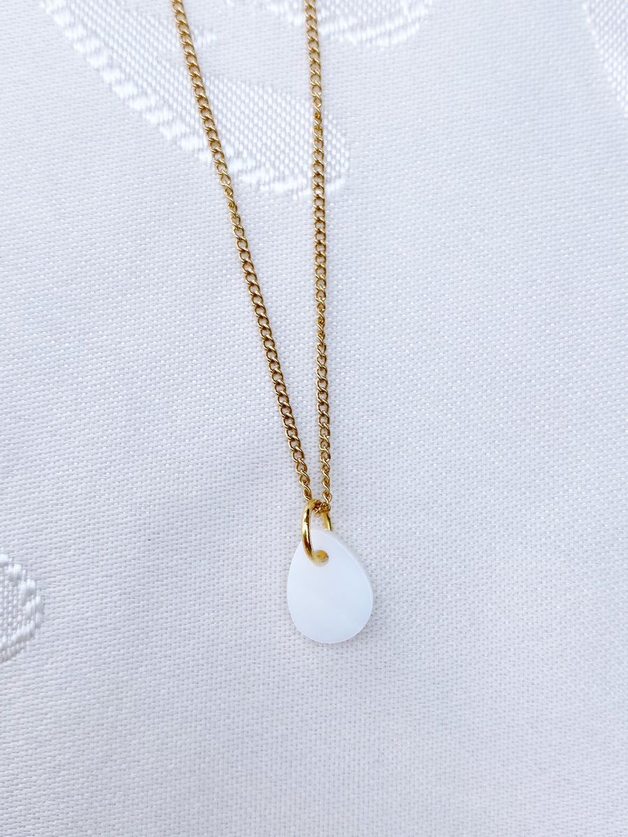 White drop charm necklace