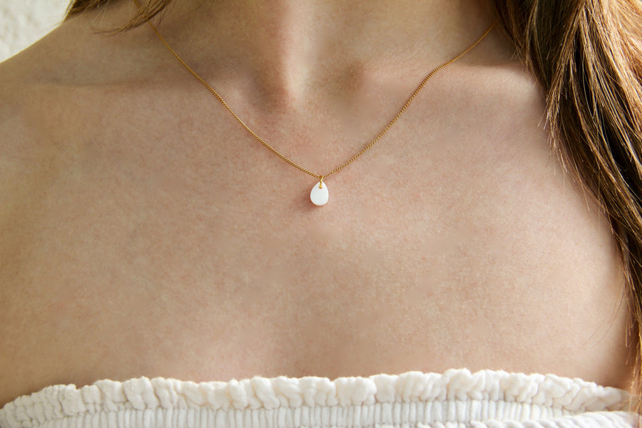 White drop charm necklace